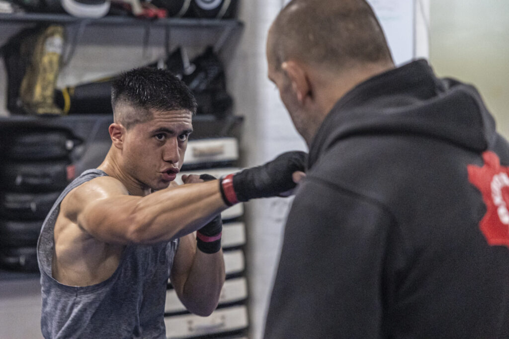 Boxer throwing a punch during training session at London Fight Factory.