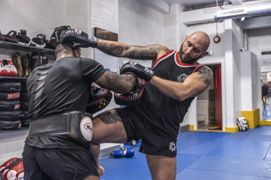 Muay Thai fighters training powerful kicks at London Fight Factory in London.