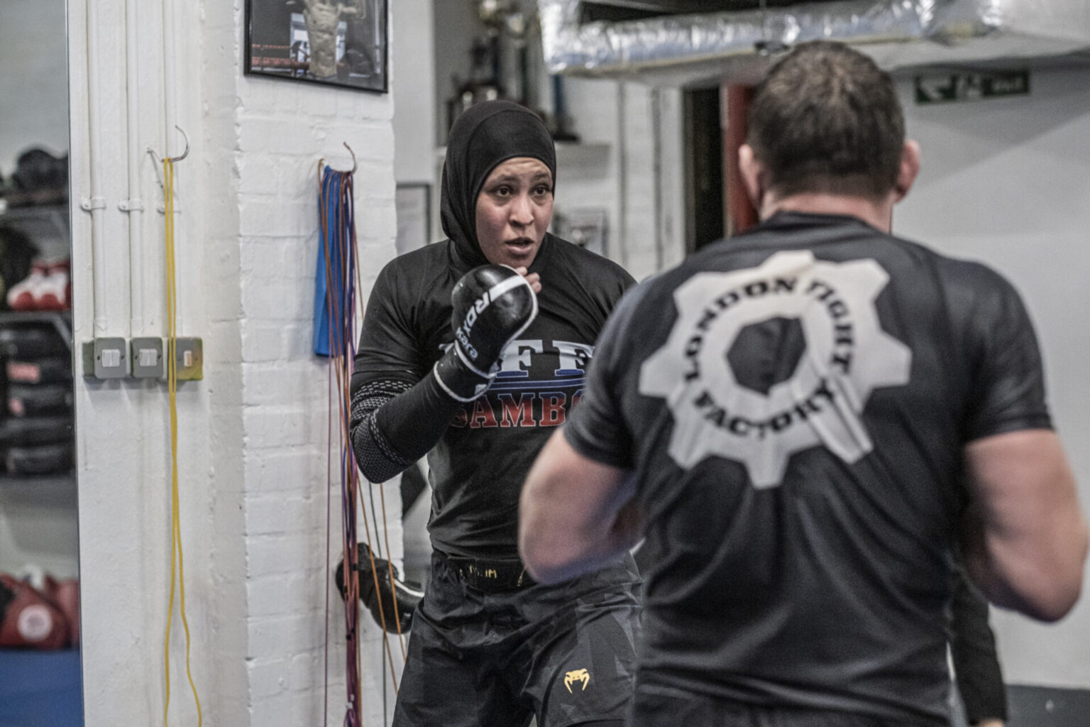 Female SAMBO fighter training with a coach at London Fight Factory.