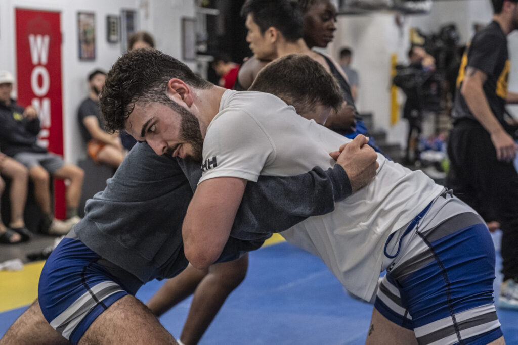 Wrestling training session with partners practicing various holds at London Fight Factory.